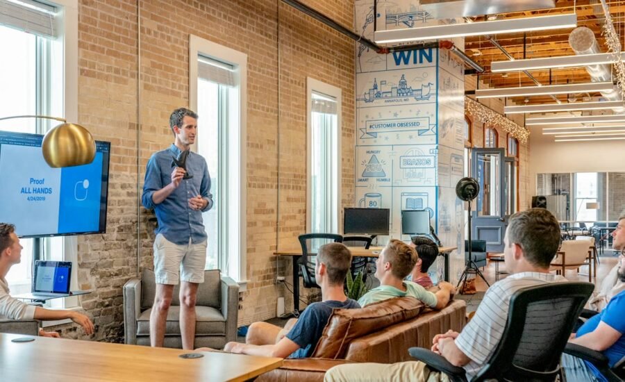 Business colleagues collaborating in a modern office, representing internal AI knowledge assistants on Microsoft Teams and SharePoint